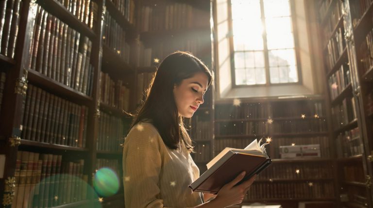Woman reading in a library